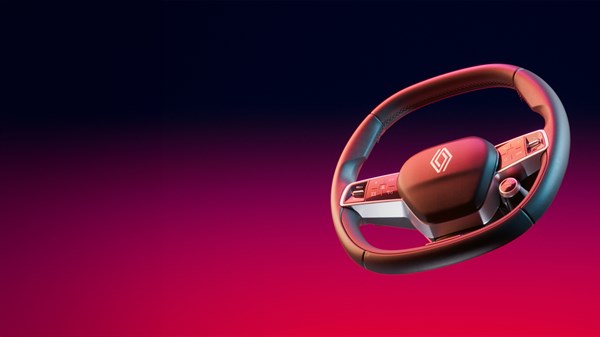 Volan Renault z logotipom na barvnem studijskem ozadju.