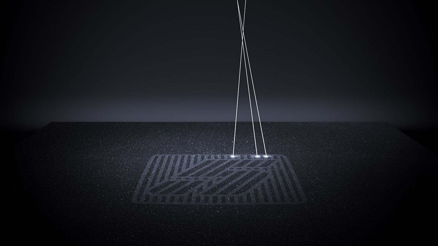 Lasersko graviranje logotipa "5" na temni površini.