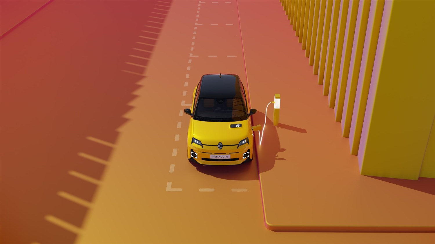 Renault 5 rumene barve, pogled od spredaj med polnjenjem na polnilni postaji.