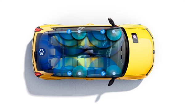 Pogled od zgoraj na rumeno vozilo Renault 5 z zvočniki Harman Kardon® v notranjosti.