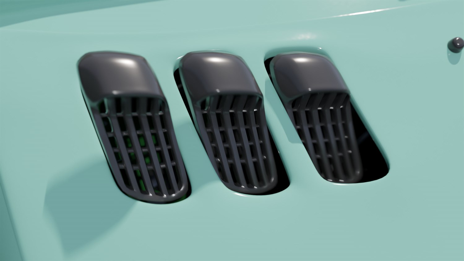 Tri zračne reže na pokrovu modrega vozila.