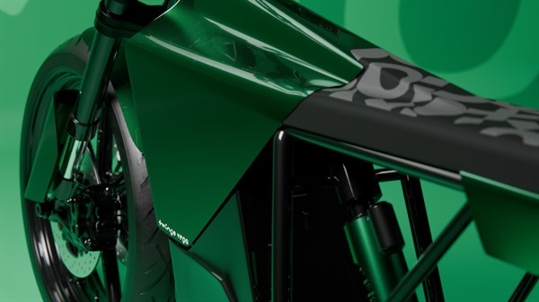 Detajl sprednjega kolesa in okvirja zelenega motornega kolesa (vilice, zavorni disk in vzmetenje).